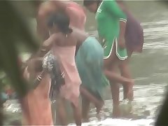 Indian women bathing by the river